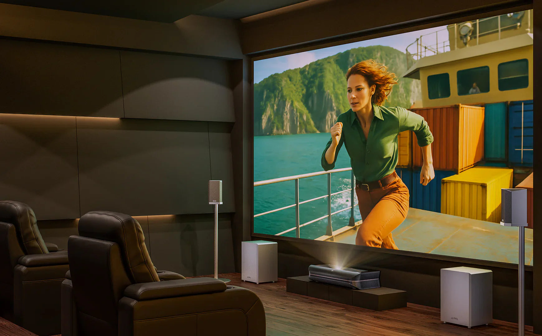 A luxurious, dedicated home cinema, an example of the ultimate entertainment room, featuring a massive projector screen, leather recliners, and a surround sound system.