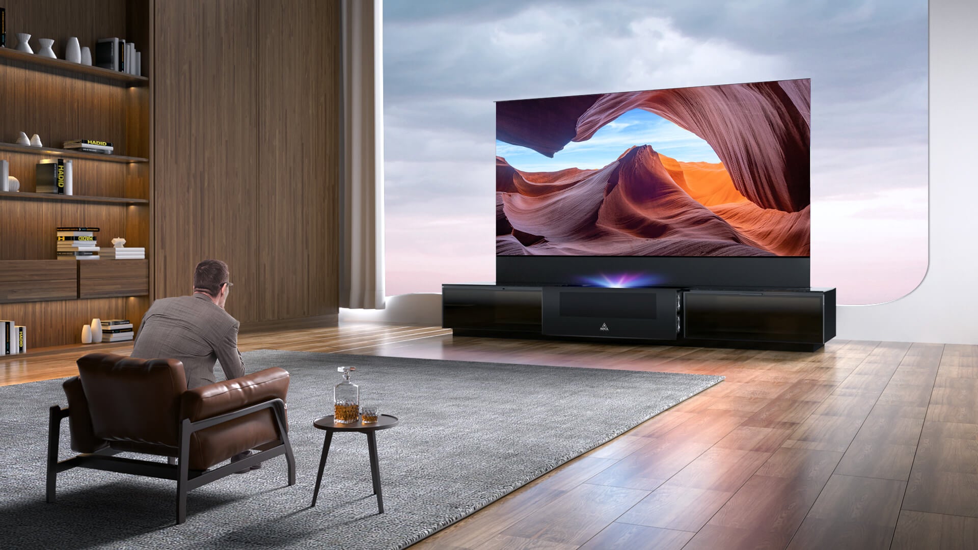 Man watching a Laser TV in a spacious modern living room