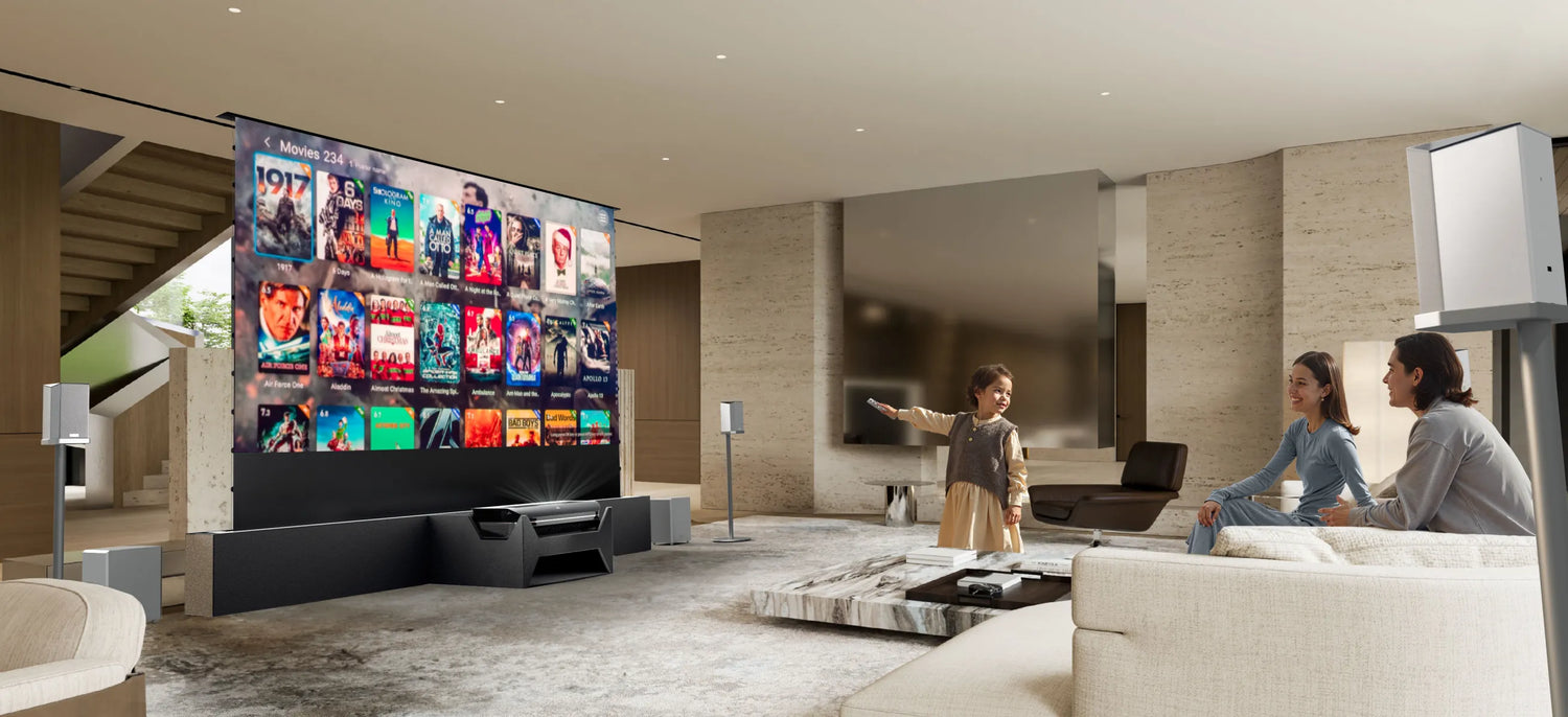 A family watches movies on a large projector screen in a modern living room, demonstrating an ultimate Roku projector setup.