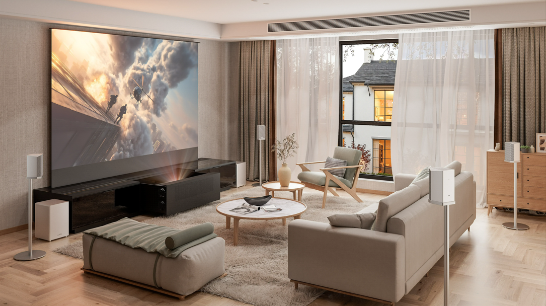 A stylish, well-lit living room featuring a large projection screen and an ultra-short throw (UST) projector, showcasing a modern home theater setup that can replace a TV.
