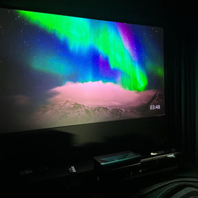 LTV-3000 Pro 4K 3D projector showcasing the vivid colors of the northern lights in a dark room setting, enhancing the home cinema experience.