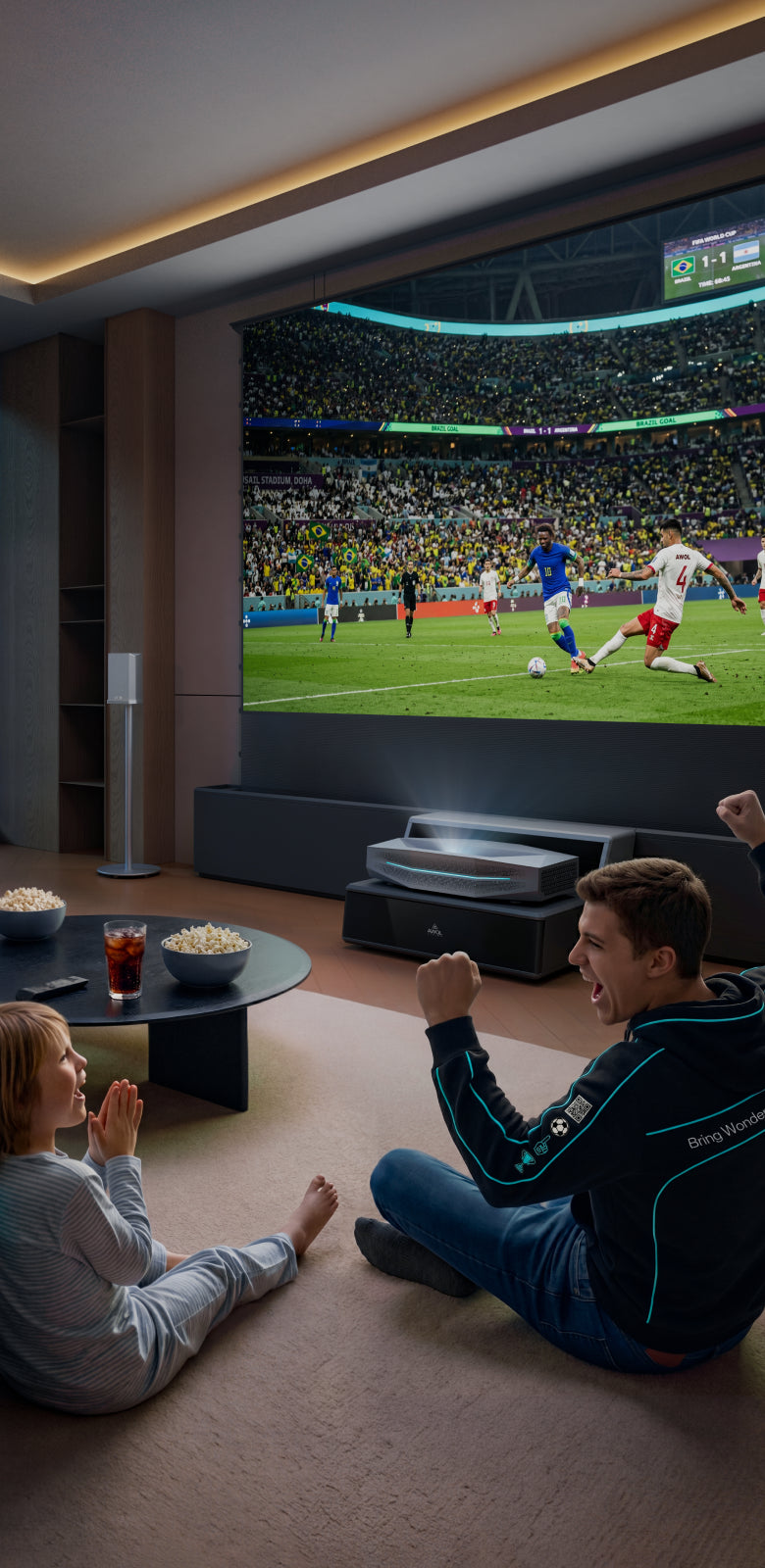 Family watching a soccer game day match on an AWOL Vision home theater projector.