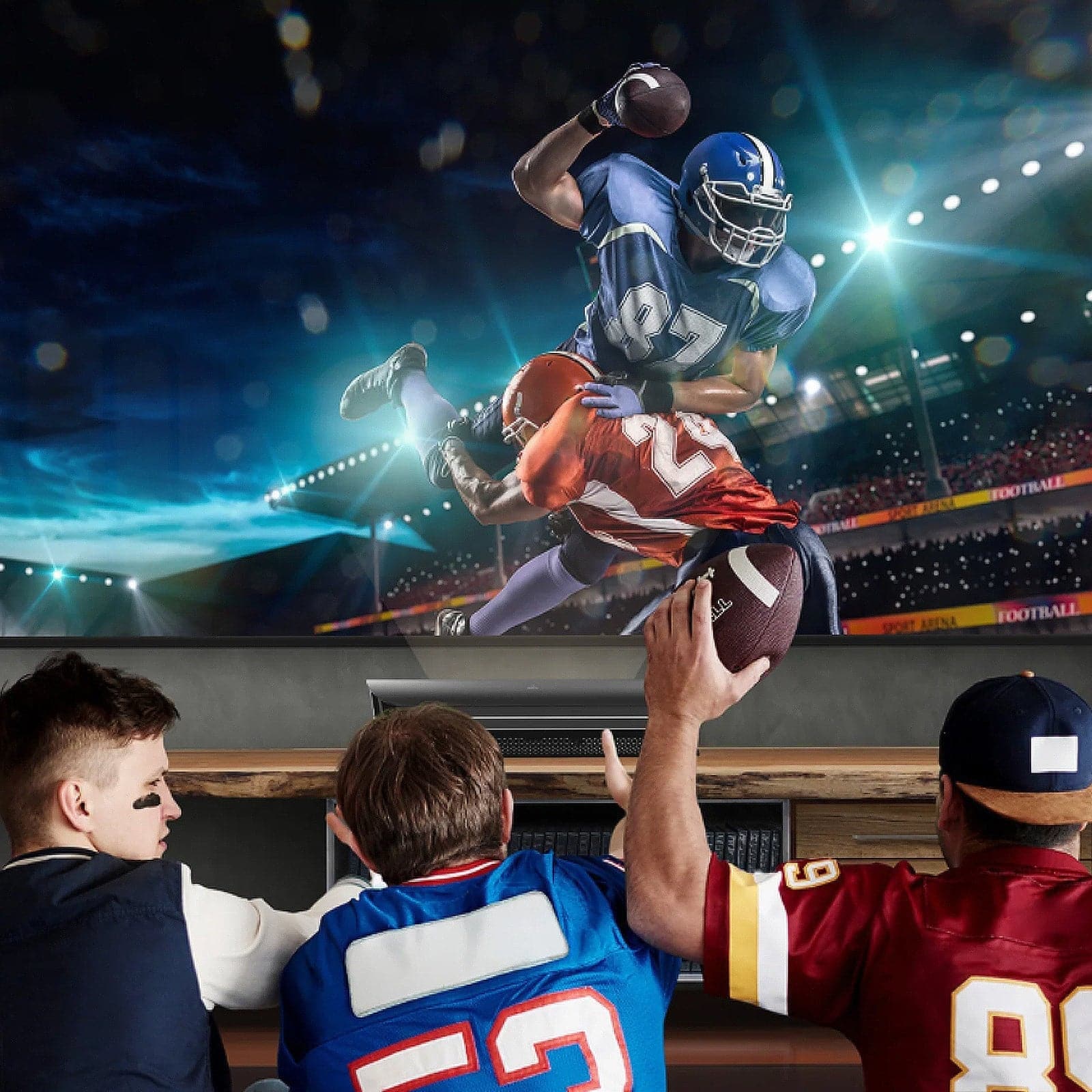 Fans enjoying a lifelike football game displayed on LTV-2500 Dolby Atmos Projector in a dynamic home entertainment setup.