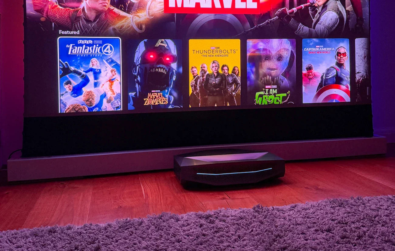 An ultra-short throw smart projector displaying a modern streaming menu with various movie titles, illustrating how these devices function as a built-in entertainment hub similar to a smart TV.
