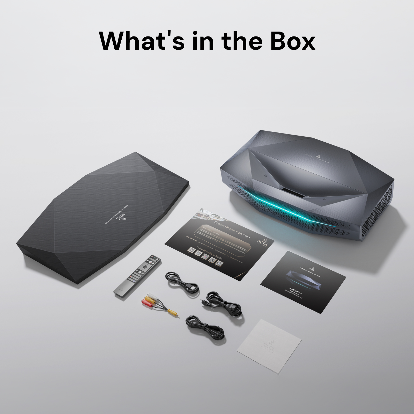 AWOL Vision Aetherion Max 4K RGB laser ultra short throw projector box contents with remote, cables, cover, and contact information card. 